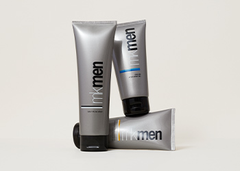 MKMen Skin Care, featuring three products standing up, some of them stacked, pictured over a light gray background