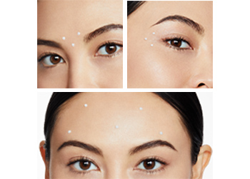 Close-up images of Dynamic Wrinkle Limiter applied to key zones (between brows, extended crow’s-feet and forehead) on brunette woman 