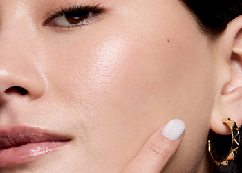 Model confidently looking at camera showing off strong, healthy skin