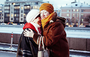 Two women hugging as part of the Mary Kay #BeautyOfConfidence mission to help women accept compliments with confidence